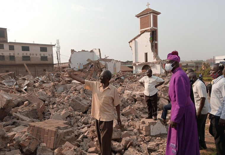 Bishop-and-church-goers-at-demolition-site-155ab9bc