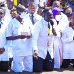 Dr-Oledo-kneeling-at-Kololo-afba3e90
