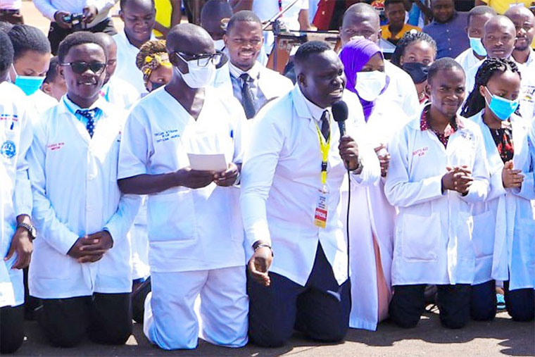 Dr-Oledo-kneeling-at-Kololo-afba3e90